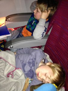 Traveling with a baby- what do I pack? Kids on a plane Two In A Row blog Sue collins