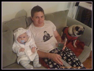 Dad Baby & pug co-exist on couch Two In A Row BLog Sue Collins